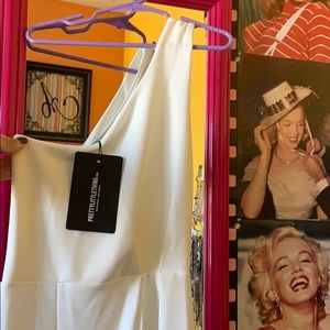 Never worn, tag still on! Size: USA 0